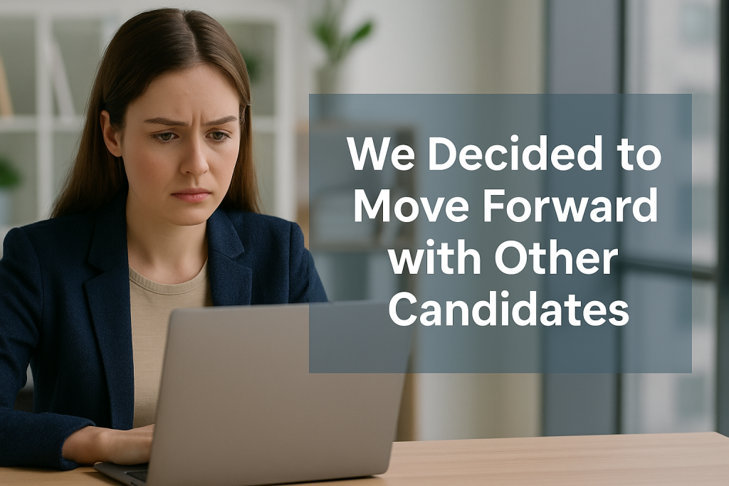A young professional in a modern Canadian office reads a rejection email on a laptop, with centered text overlay that says “What ‘We Moved Forward With Other Candidates’ Really Means.”